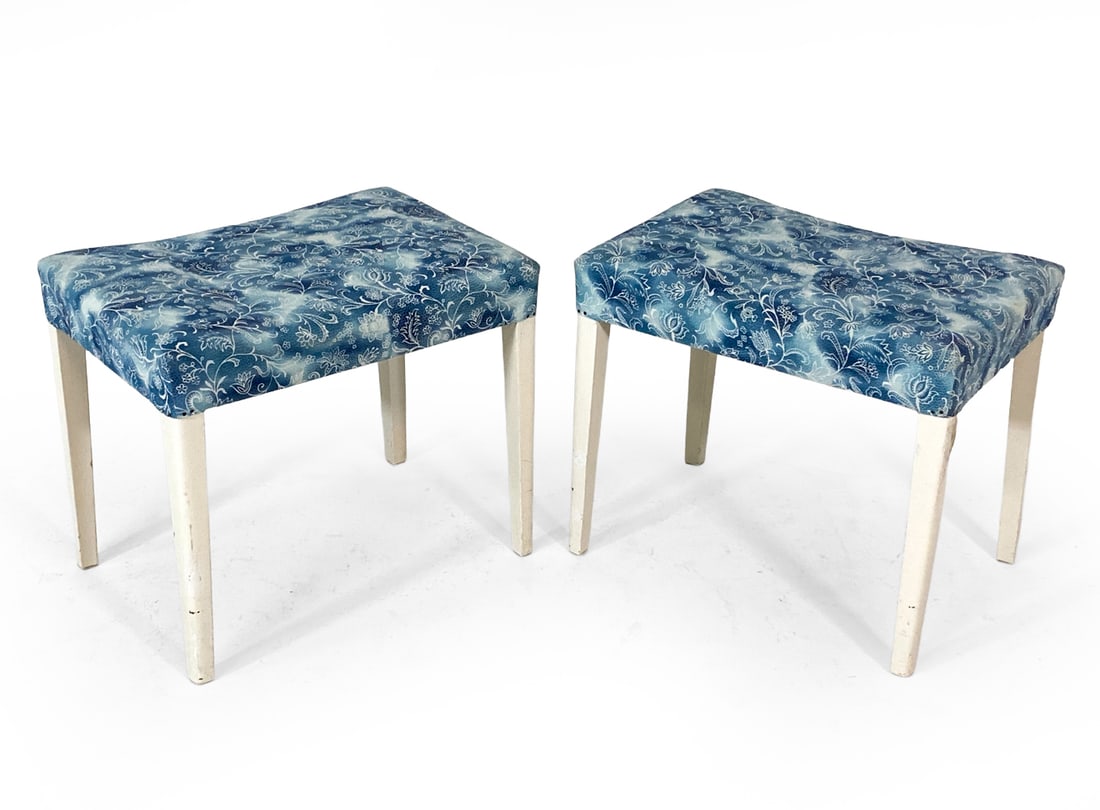 PAIR OF SCANDINAVIAN OTTOMAN STOOLS C. 1960S: Tapered beech legs in white painted finish. Blue patterned fabric upholstery. Scandinavian, circa 1960s. Dimensions: H 16" x W 19" x D 13.5". Condition: Scuffs and chips to paint on legs. Wear consist