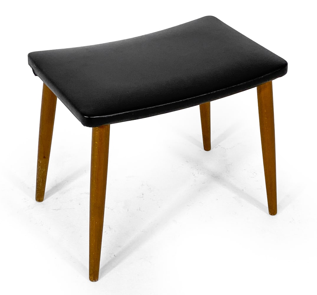DANISH STOOL C. 1960S: Tapered beech legs with black vinyl upholstery. Denmark, circa 1960s. Dimensions: H 15.5" x W 18" x D 12". Condition: Few tiny white spots to vinyl. Wear consistent with age and use. V173
