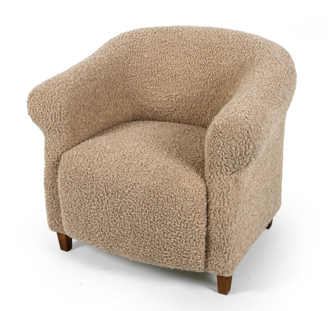 BOESEN STYLE DANISH BOUCLE LOUNGE CHAIR C. 1960S: Rounded form with integrated armrests and low seat. Stained beech legs and textured boucle upholstery. Denmark, circa 1960s. Dimensions: H 30" x W 31" x D 30", SH 16" Condition: Light surface wear con
