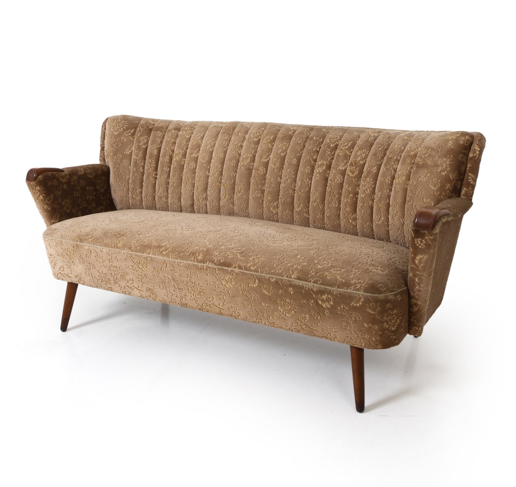 GERMAN VELVET SOFA C. 1960S: Three-seater sofa in beech frame and floral velvet upholstery. Germany, circa 1960s. Dimensions: H 29" x W 64" x D 30" x SH 17" Condition: Rubs to legs. Fading and minor fraying to fabric. Wear consis