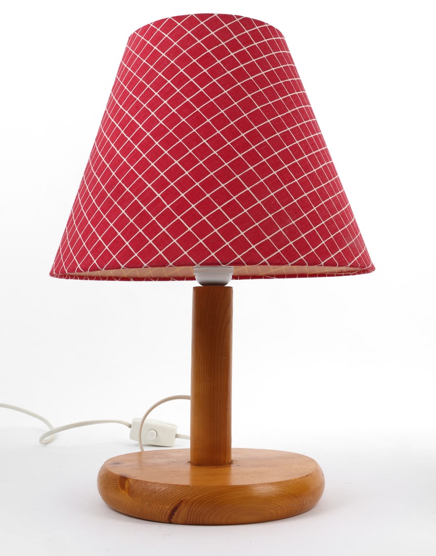 SWEDISH PINE TABLE LAMP C. 1970S: Pine lamp with red fabric shade. Sweden, circa 1970's. Dimensions: H 17 " x Diameter 12" Condition: European Plug. Untested. Light fading to lamp shade. Scuffs, nicks to wood frame. Wear consistent wi