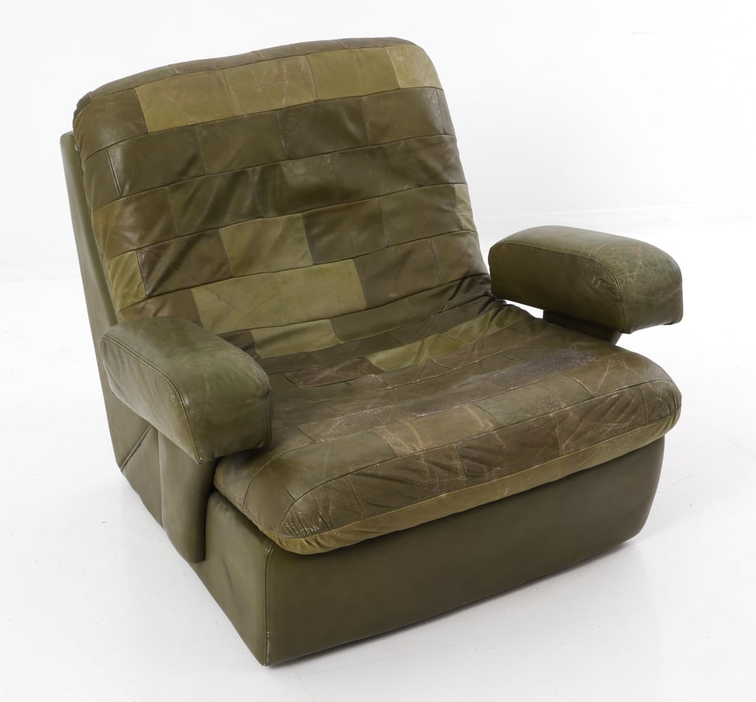 STYLE OF ROLF BENZ GERMAN LEATHER LOUNGE CHAIR: Armchair in green patchwork leather upholstery. Germany, circa 1970s. Dimensions: H 31" x W 34.5" x D 37" x SH 15.5" Condition: Some scuffs to the leather. Discoloration to armrests. Loss to edges at