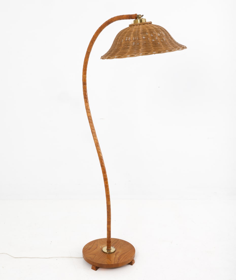 MARKSLOJD SWEDISH BEECH FLOOR LAMP C. 1960S: Beech frame gooseneck floor lamp, with wicker shade. Apparently unmarked. Sweden, circa 1960's. Dimensions: H 61" x W 30" x D 19" Condition: Wear consistent with age and use. Untested. European cord.