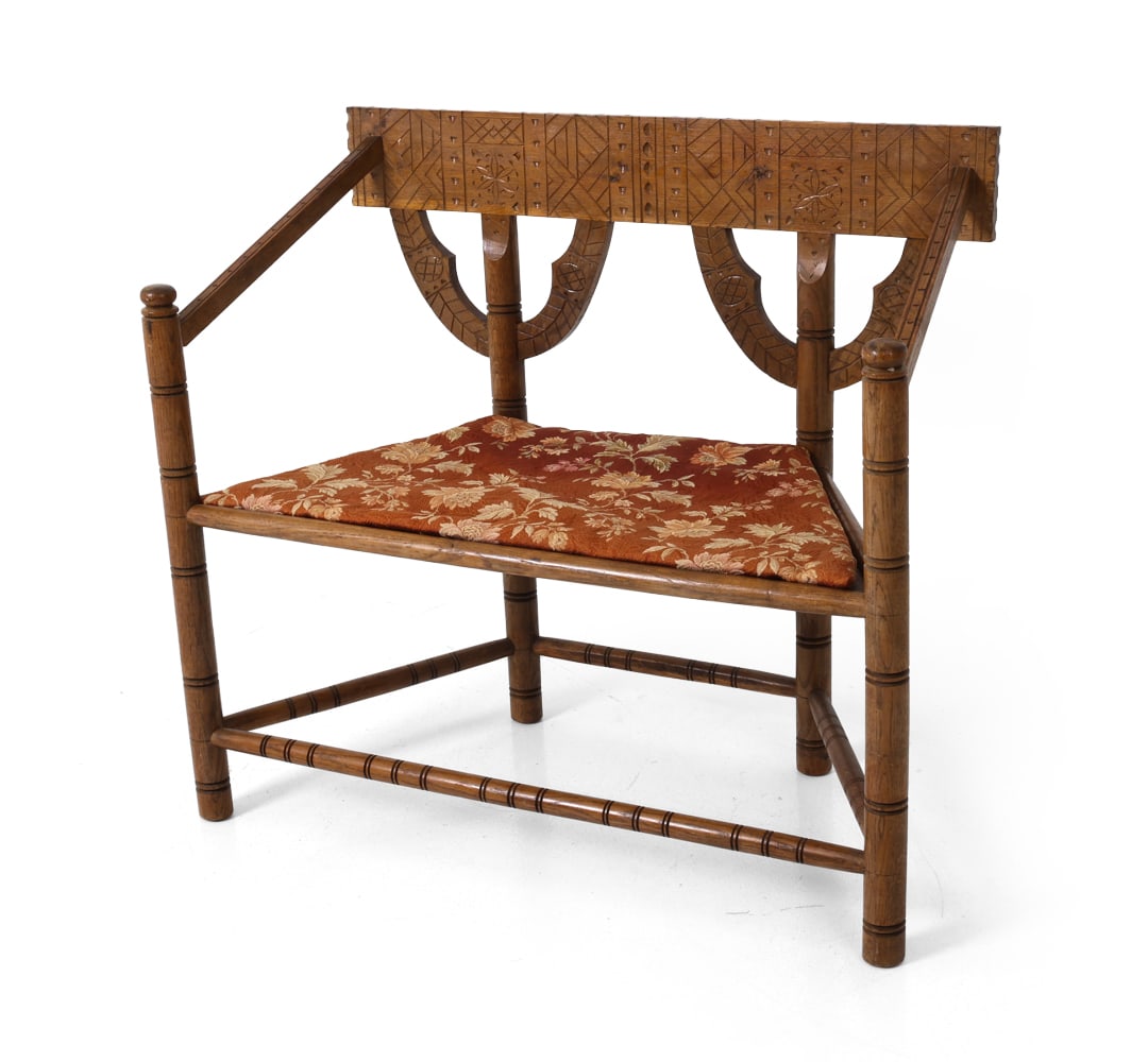 SWEDISH CARVED OAK MONK BENCH C. 1920S: Monk bench with carved geometric patterns to back panels and turned legs. Sweden, circa 1920s. Dimensions: H 34" x W 37.75" x D 17" x Sh 17.5" Condition: Light fading to finish. Minor scuffs to frame.