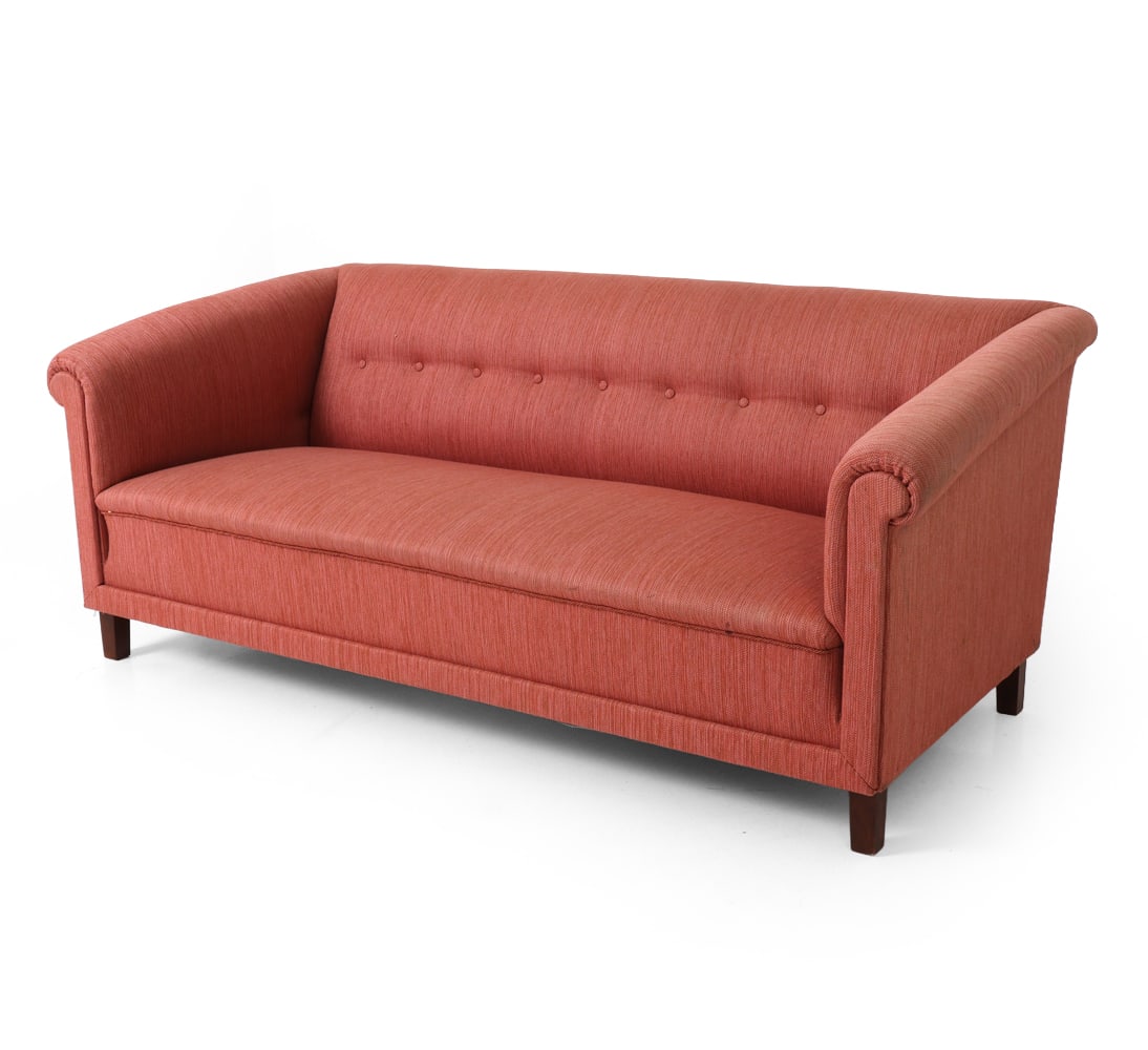 STYLE OF MALMSTEN SWEDISH SOFA C. 1950S: Curved back with button tufting and outward-rolling arms. Coral woven upholstery. Sweden, circa 1950s. Dimensions: H 29" x W 72.5" x D 35" x Sh 15" Condition: Minor dent to back of backrest, Wear cons