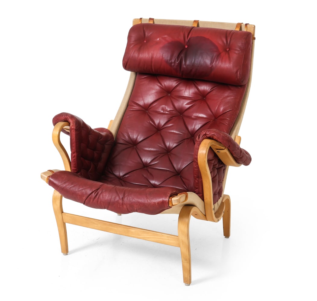 BRUNO MATHSSON FOR DUX "PERNILLA" LOUNGE CHAIR: Model Pernilla 69 chair by Bruno Mathsson for Dux. Bentwood beech frame. Red leather upholstered cushions with leather straps and canvas sling. Marked to frame. Sweden, circa 1970s. Dimensions: H 39"