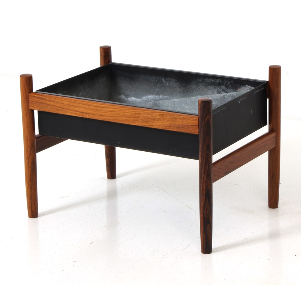 HUGO FRANDSEN FOR SPOTTRUP ROSEWOOD PLANTER 1960S: Rosewood frame with a black-painted metal insert tray. Apparently unmarked. Denmark, circa 1960s. Dimensions: H 14.5" x D 15" x W 21" Condition: Loss and scuffs to metal. Rubs and nicks to frame. Wear