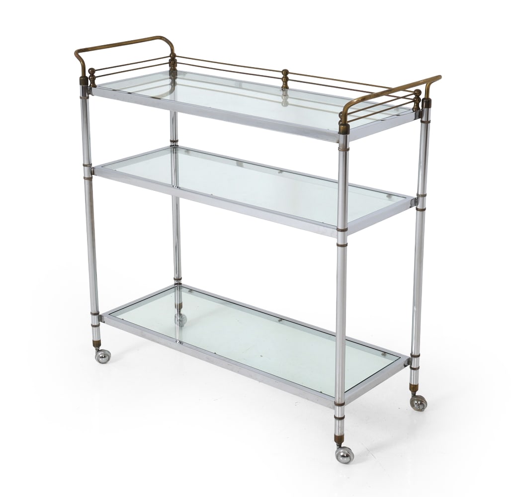 HOLLYWOOD REGENCY STYLE BAR CART: 3 Tiered serving cart with beveled glass shelves. Same example sold at Christie's, London, 9/18/2012, lot 279. Circa 20th Century. Dimensions: H 39.25" x W 41" x D 15.75" Condition: Lights scuffs to m