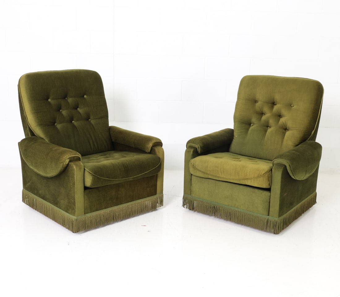 PAIR OF SCANDINAVIAN VELOUR LOUNGE CHAIRS C. 1970S: Tufted button green velour upholstery with padded arms and fringe details. Scandinavian, circa 1970s. Dimensions: H 35.25" x W 31.75" x D 31" x Sh 15.5" Condition: Minor sun-fading present, Wear
