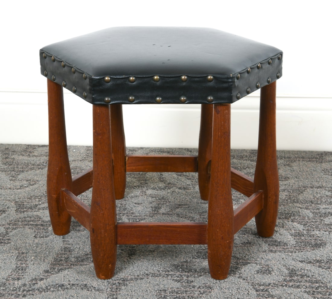 SCANDINAVIAN TEAK & LEATHER STOOL C. 1960S: Turned teak legs with black leather upholstery. Scandinavian, circa 1960s. Dimensions: H 13.5" x Dia. 16". Condition: Few small punctures to leather in center of seat. Scuffs and rubs to legs. Wear