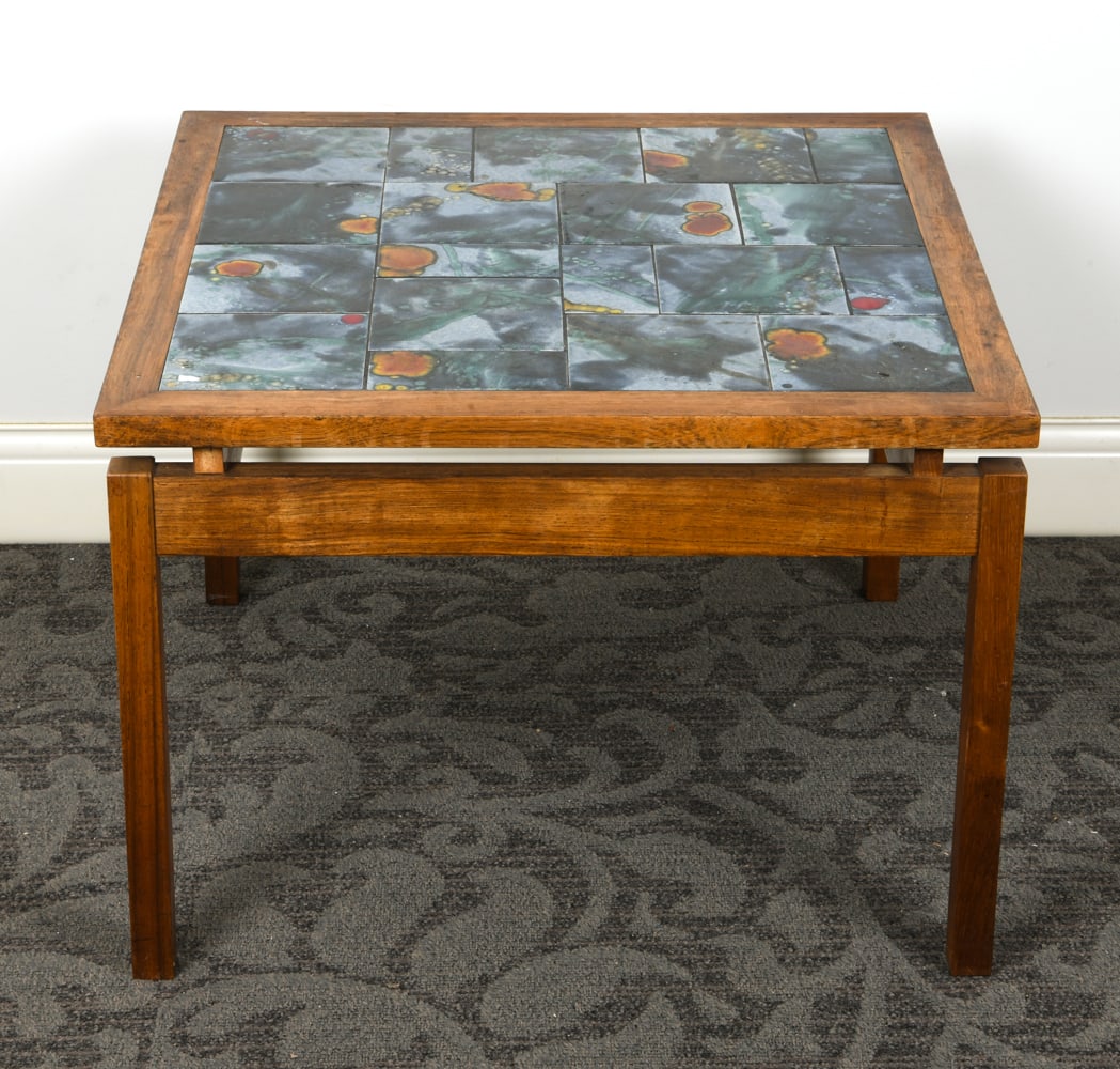 DANISH ROSEWOOD & CERAMIC TILE SIDE TABLE: Rosewood table with ceramic tiles inlaid to top. Denmark, circa 1970s. Dimensions: H 19.75" x W 27.75" x W 27.75". Condition: Fading and few water spots to top and legs. Wear consistent with age and u