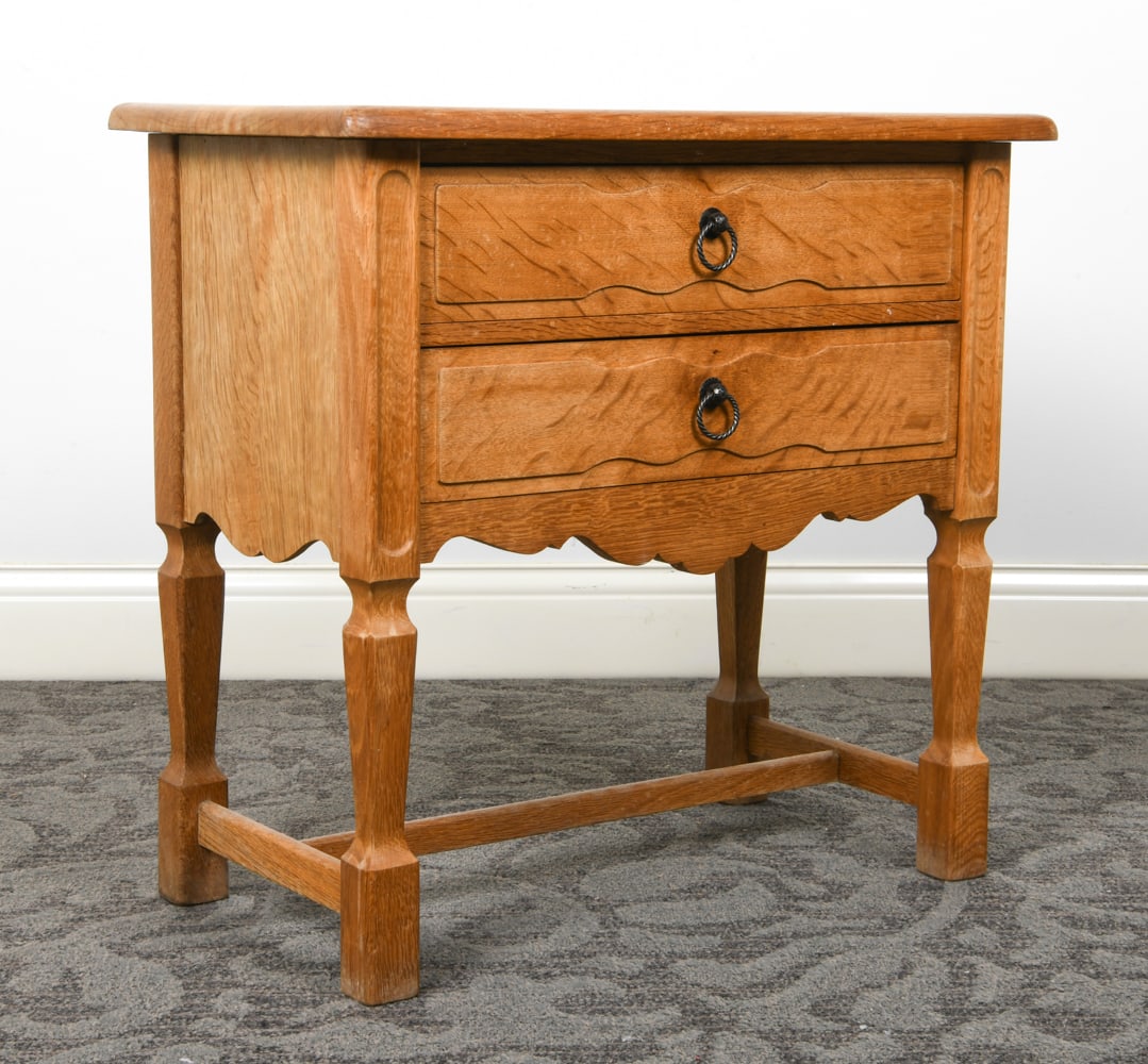 HENNING KJAERNULF STYLE OAK SIDE TABLE C. 1970S: Oak side table with (2) drawers. Iron ring drawer pulls. Denmark, circa 1970s. Dimensions: H 25.5" x W 26.25" x D 15". Condition: Slight fading and water spots to top. Wear consistent with age and