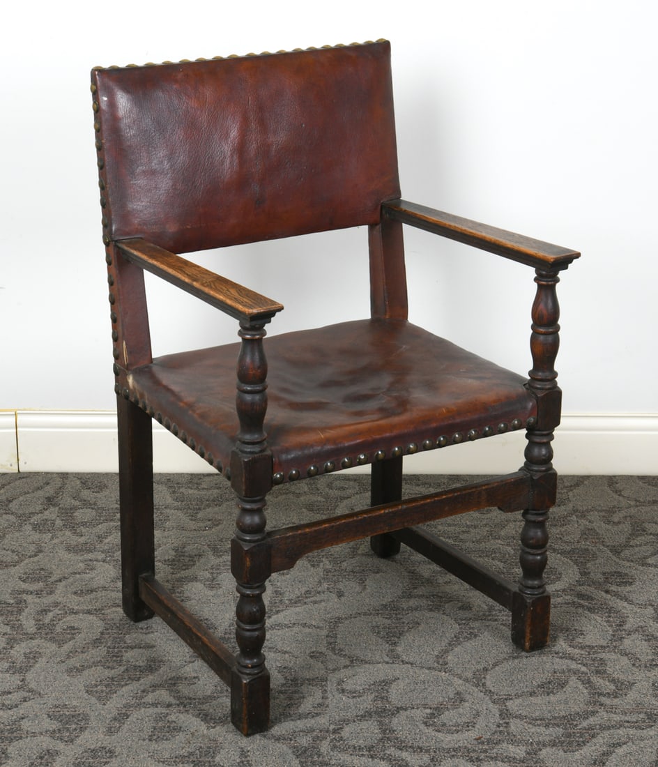 SCANDINAVIAN OAK & LEATHER ARMCHAIR C. 1950S: Oak frame with brown leather upholstery. Scandinavian, circa 1950s. Dimensions: H 36.5" x W 22" x D 20.5" x SH 18.25". Condition: Scratches and dings to wood. Dents and scratches to leather. Wear