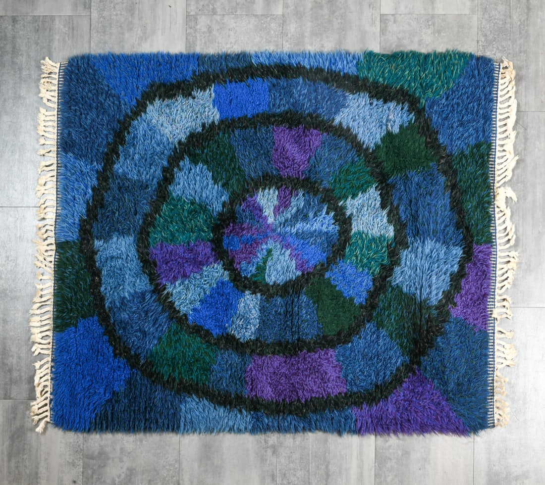 DANISH SHAG WOOL RUG C. 1970S: Shag wool rug with blue, purple, and green design. Denmark, circa 1970s. Dimensions: H 58" x W 47". Condition: Dust/surface soiling. Wear consistent with age and use.