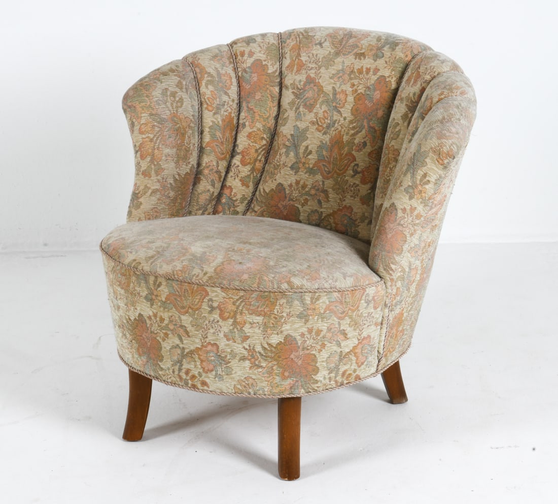 SLAGELSE STYLE DANISH COCKTAIL CHAIR C. 1960S: Floral fabric upholstery with beech legs. Denmark, circa 1960s. Dimensions: H 30" x W 31" x D 29" x Sh 16.5". Condition: Wear consistent with age and use. EN100