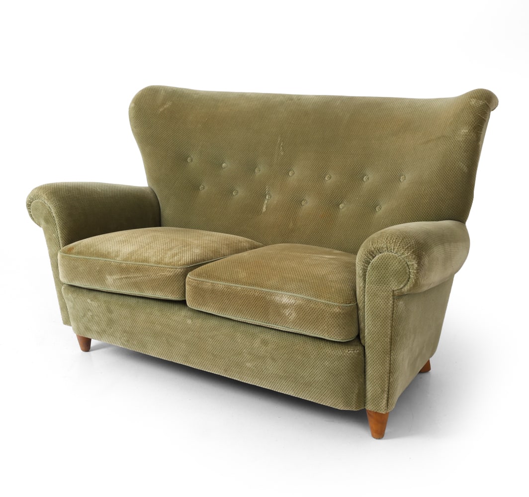 SWEDISH VELOUR LOVESEAT C. 1970S: Beech legs and green embossed velour upholstery. Buttoned backrest and scrolled armrests. Sweden, circa 1970s. Dimensions: H 36.5" x W 59" x D 35" x Sh 17.5" Condition: Sun-fading and spots of discolo