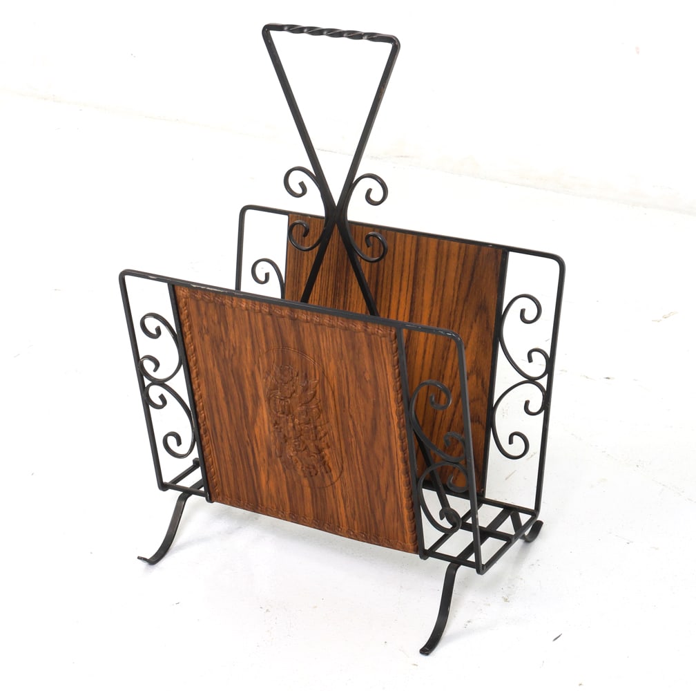 GERMAN IRON MAGAZINE RACK CIRCA 1980'S: Germany, circa 1980's. Dimensions: H 22" x W 14" x D 11" Condition: Minor paint loss, scuffs and oxidizing.
