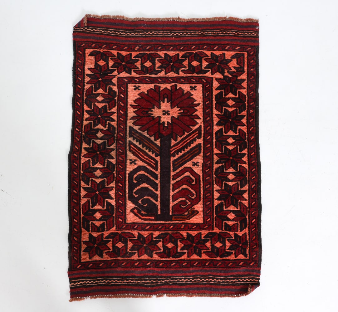 HAND-KNOTTED AFGHAN TAJIK CAUCASIAN WOOL RUG: Hand-knotted wool rug featuring a geometric tree-of-life motif. Dimensions: L 50" x W 33". Condition: Light fading. Loss to fringe. Wear consistent with age and use.