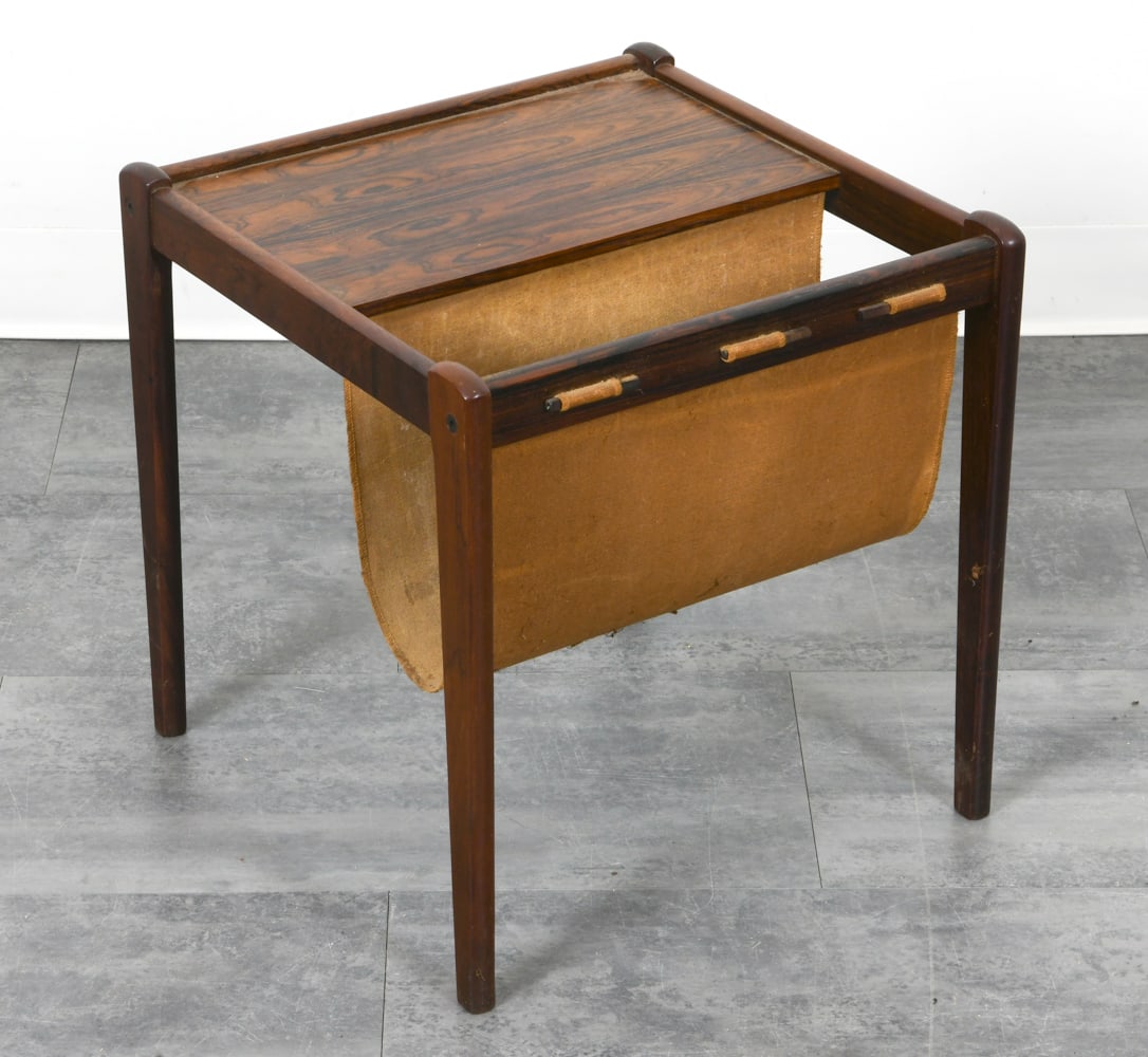 DANISH BRDR FURBO ROSEWOOD MAGAZINE RACK C. 1970S: Rosewood frame with canvas sling. Denmark, circa 1970s. Dimensions: H 18.25" x W 18.25" x D 18.25". Condition: Faint scuffs to frame, wear consistent with age and use.