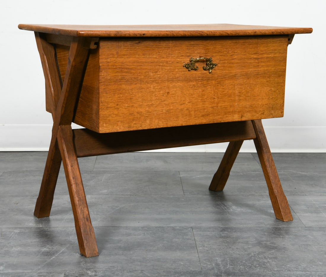 HENNING KJAERNULF OAK SEWING CHEST C. 1970S: Oak sewing chest with x-shaped legs. Brass pull. Apparently unmarked. Denmark, circa 1970s. Dimensions: H 21" x W 26.5" x D 17". Condition: Slight fading, wear consistent with age and use.