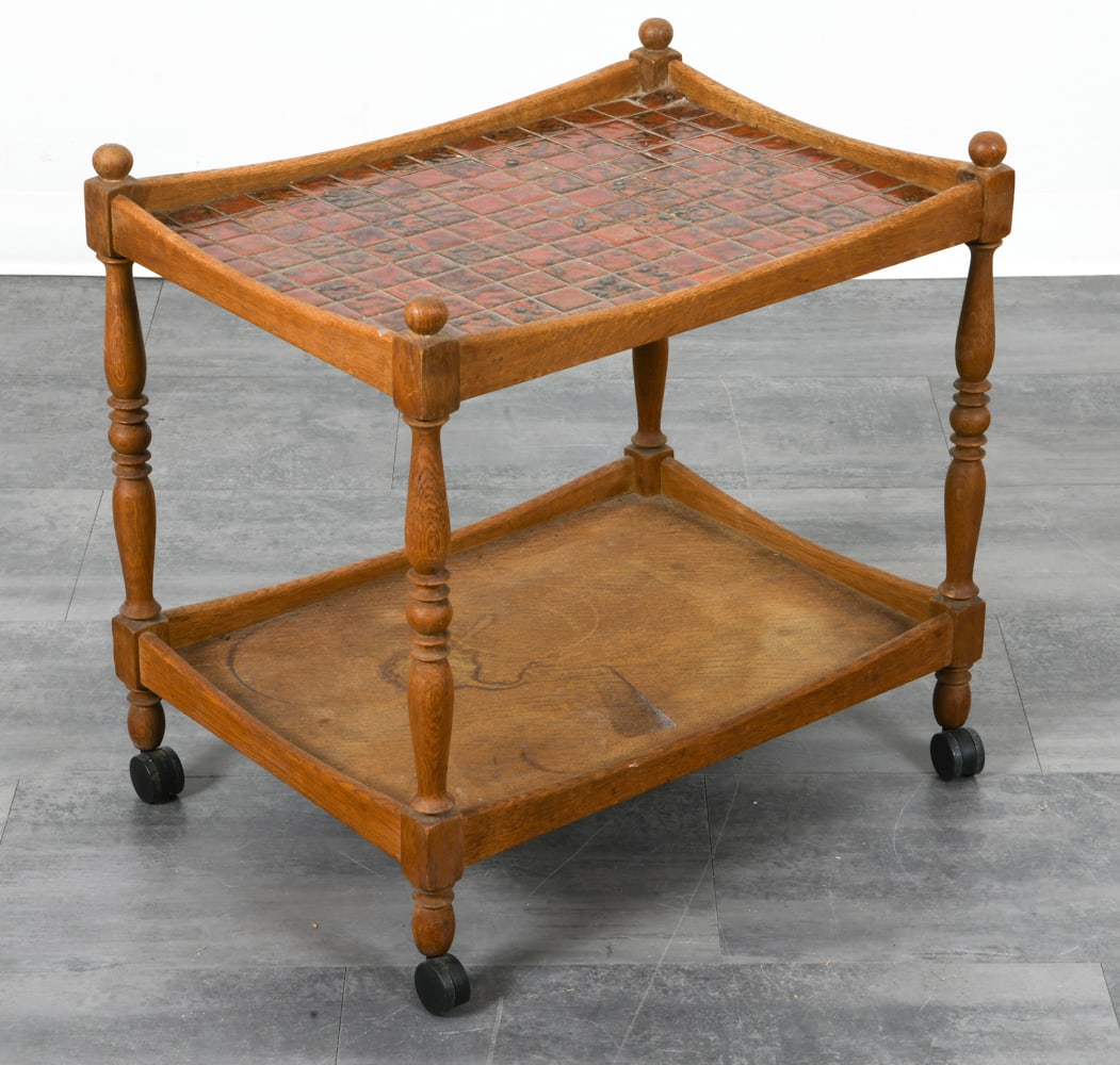 DANISH OAK & CERAMIC TILE BAR CART C. 1960S: Oak bar cart with red ceramic tiles inlaid to top. Denmark, circa 1960s. Dimensions: H 24.25" x W 24.5" x D 18". Condition: Water rings and scratches, some surface soiling. Wear consistent with age an