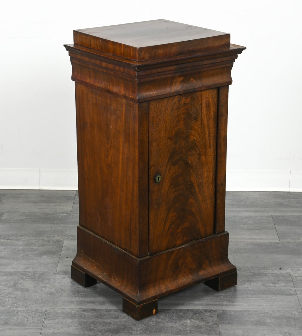 SCANDINAVIAN MAHOGANY PEDESTAL CABINET C. 1900: Mahogany cabinet in pedestal shape. Fabric lined shelves. Scandinavian, circa 1900s. Dimensions: H 38.5" x W 18.5" x D 17". Condition: No key. Scuffs and scratches, some slight fading on top. Wear con