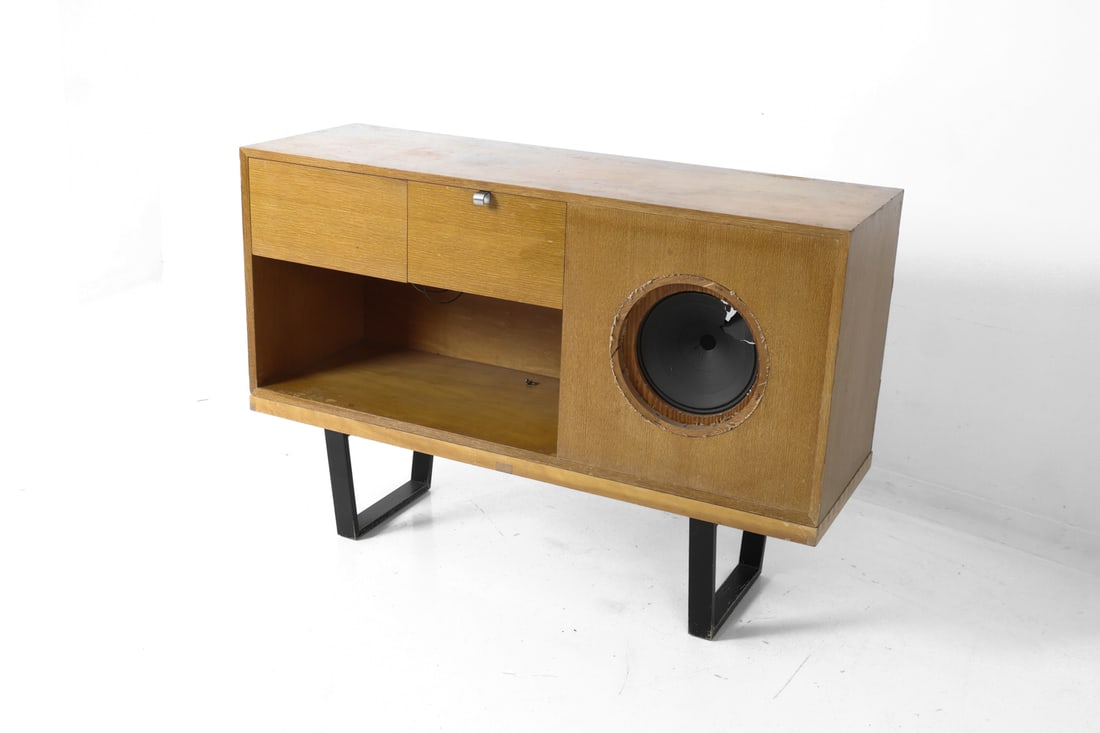 GEORGE NELSON HERMAN MILLER STEREO CABINET & BENCH: Stereo cabinet with slat bench base and instruction manual. Circular cutout for a speaker, along with a top drawer and an open lower compartment for audio components. Circa 1950s. Dimensions: Arranged