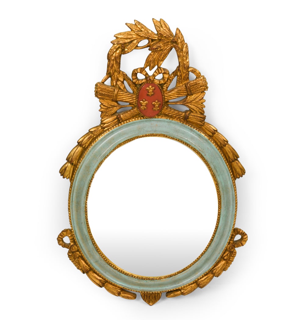 CARVERS GUILD FRENCH STYLE OVAL WALL MIRROR: Carved and painted wall mirror with gilding. Crafted by the Carvers' Guild in Groton, MA. 20th century. Dimensions: H 30" x W 20". Condition: Scuffs and rubs to painted finish. Wear consistent with ag