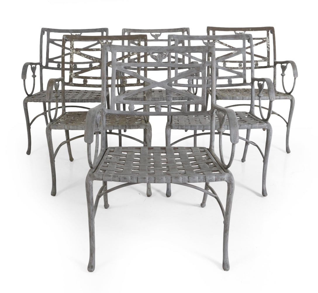 (6) TROPITONE CAST ALUMINUM PATIO ARMCHAIRS: Set of (6) cast aluminum patio armchairs. Tagged under seats. Late 20th century. Dimensions: H 32.5" x W 22.5" x D 23.5" x SH 16". Condition: Lichen growth. Scratches, scuffs, and rubs to finish. One 