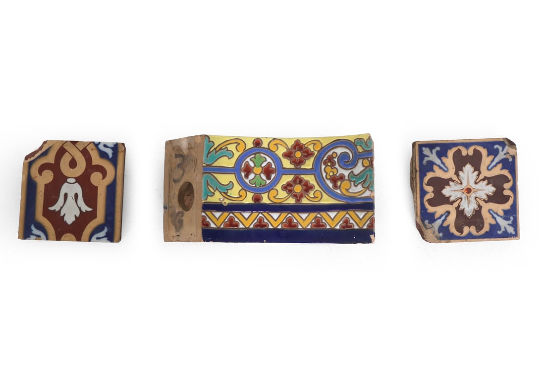 CERAMIC TILE GROUPING INCL. MINTON & CO: Decorative glazed earthenware grouping consisting of curved faience fragment and two rectangular mounting tiles. Marked to underside of tile. Late 19th century. Dimensions: Largest H 6" x W 12" x D 7"