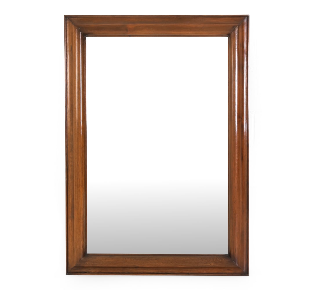 MAHOGANY BEVELED GLASS WALL MIRROR: Wall mirror in rectangular shape with mahogany frame and beveled glass. Dimensions: H 52" x W 36". Condition: Faint scuffs and rubs to wood on sides. Wear consistent with age and use.