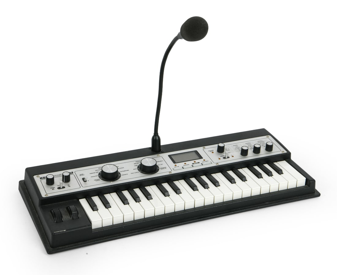 KORG MICROKORG XL SYNTHESIZER & VOCODER: Compact analog modeling synthesizer and vocoder. Includes gooseneck microphone for vocoder, 37 keys, and battery-powered portability. Circa 2000s. Dimensions: H 2.75" x W 22" x D 9.5". Condition: