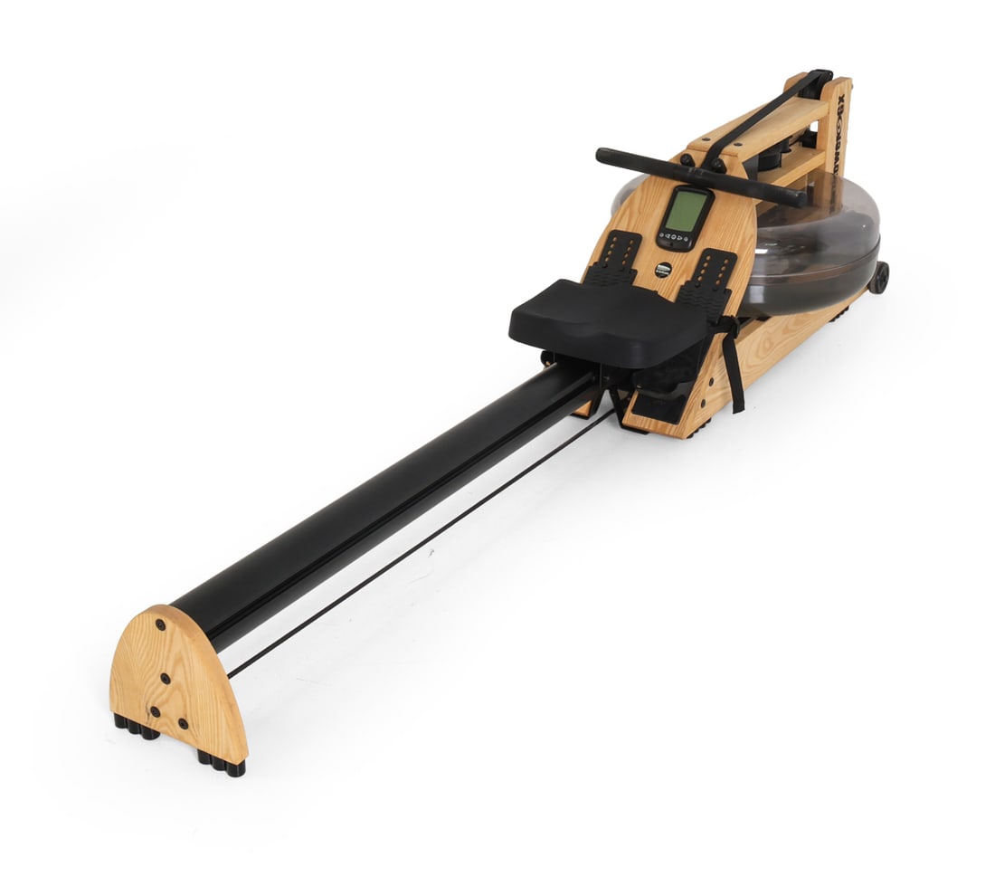 WATERROWER A1 STUDIO ROWING MACHINE: WaterRower machine with pine and aluminum construction. Tagged underneath. Dimensions: H 21.5" x W 22" x D 85.5". Condition: Faint scuffs to wood and metal. Wear consistent with age and use.