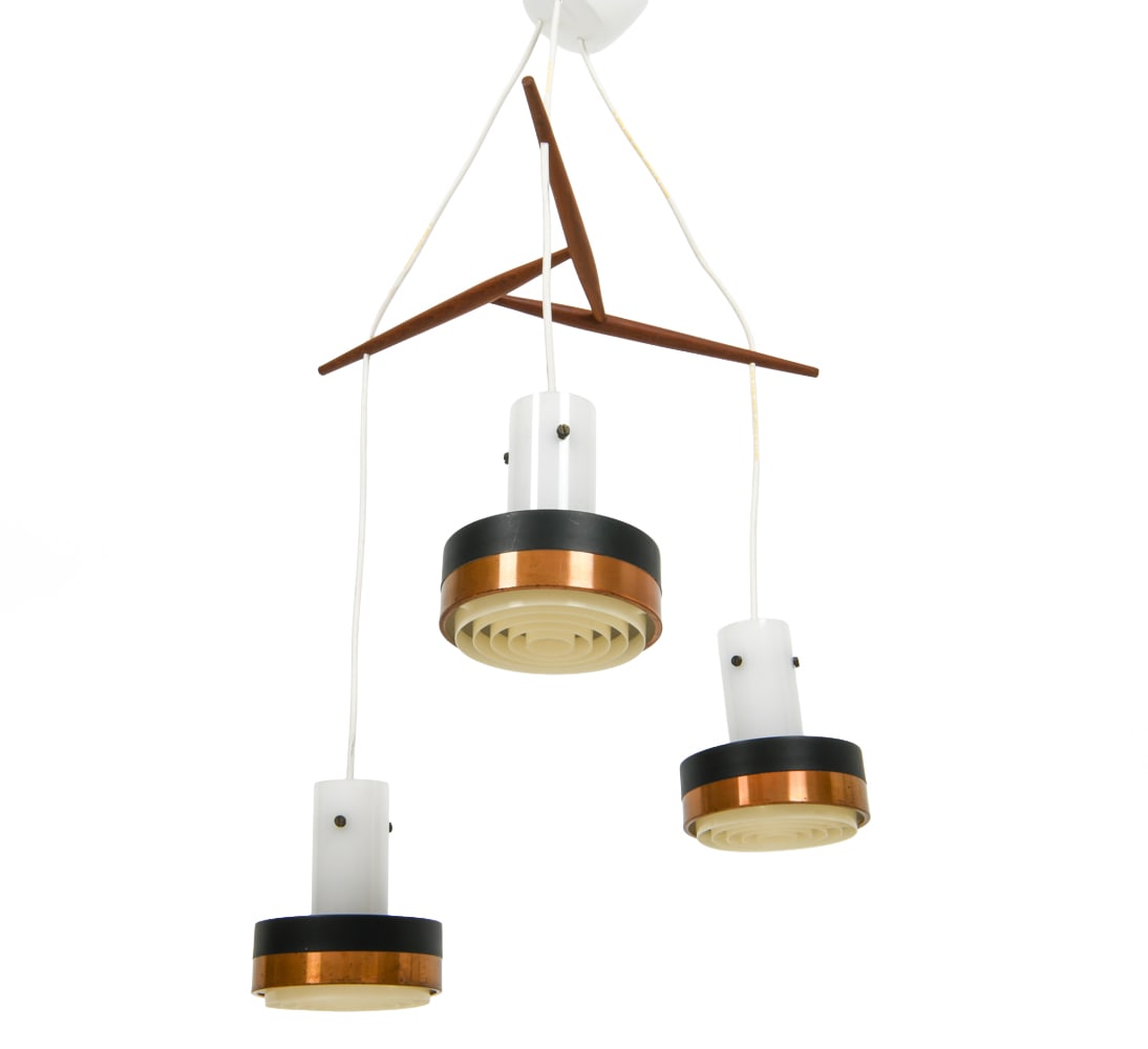 JO HAMMERBORG STYLE TEAK & COPPER PENDANT LIGHT: Pendant light with three suspended lights from teak frame. Each light with a copper and metal shade with a plastic inner shade. Denmark, circa 1960s. Dimensions: As Shown H 23" x Dia. 19". Each Shade 