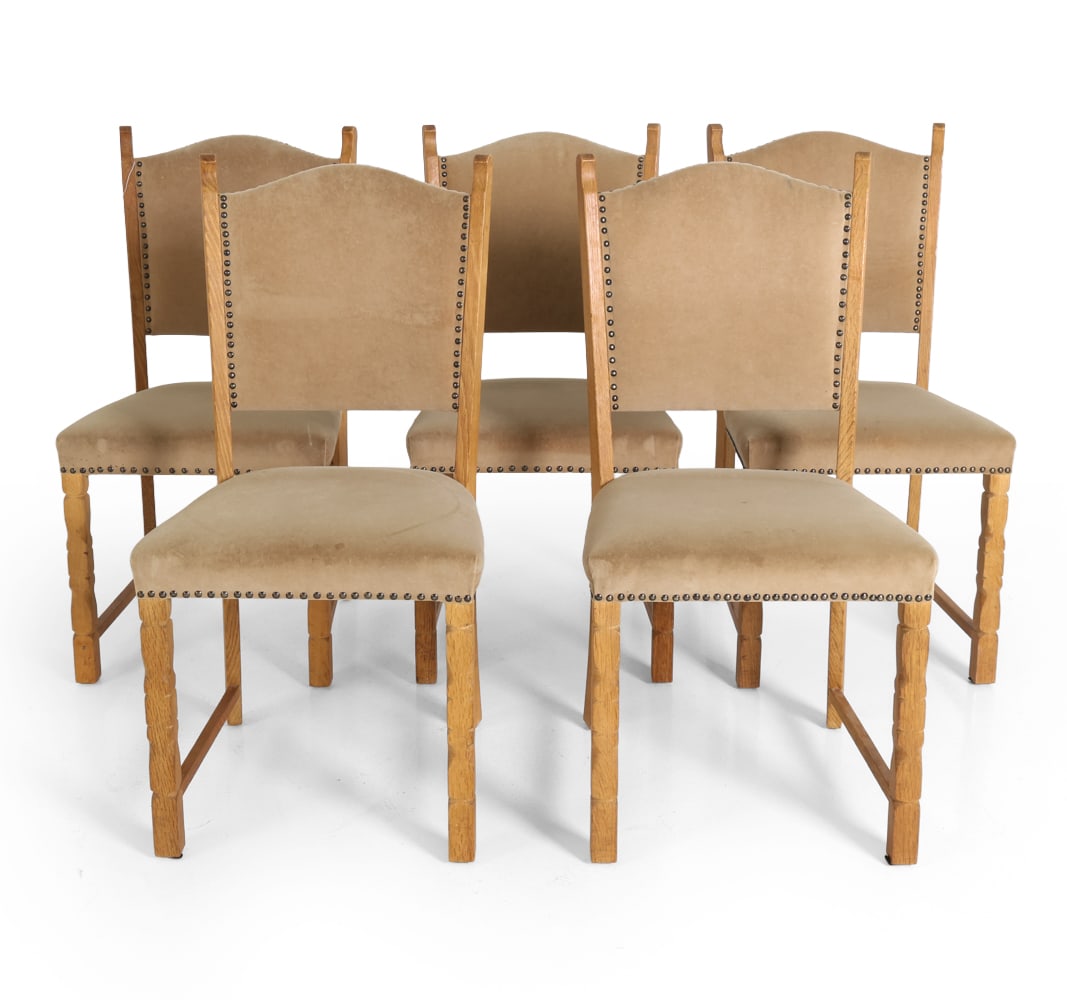 (5) KJEARNULF STYLE DANISH OAK DINING CHAIRS 1960S: Carved oak chairs with turned legs. Velour upholstery with nailhead trim. Denmark, circa 1960s. Dimensions: H 36.5" x W 18" x D 17" x SH 18" Condition: Wear consistent with age and use. Scuffs to wood