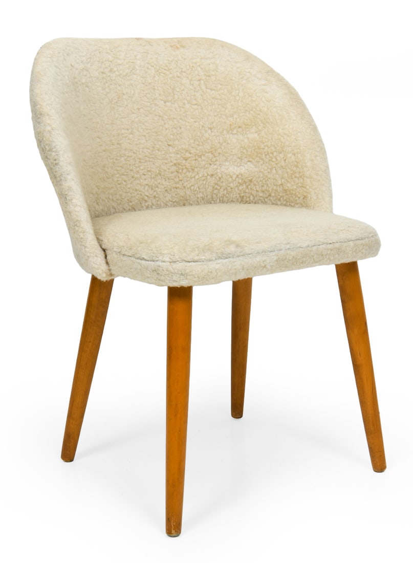 STYLE OF FRODE HOLM SHEARLING VANITY CHAIR 1960S: Vanity or dressing chair with curved backrest. Cream tone shearling upholstery and beech legs. Denmark, circa 1960s. Dimensions: H 28" x W 21" x D 17" x SH 16" Condition: Wear consistent with age and 