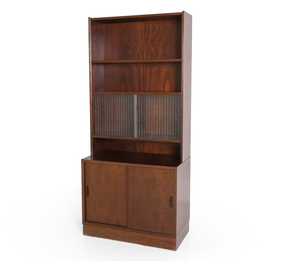 OLHOLM MOBELFABRIK MAHOGANY BOOKCASE CABINET 1960S: Key included. Two-part construction in mahogany. Top sits freely on the base. Upper section with adjustable shelf over glass sliding doors with interior storage. Lower cabinet has triangular inset pul