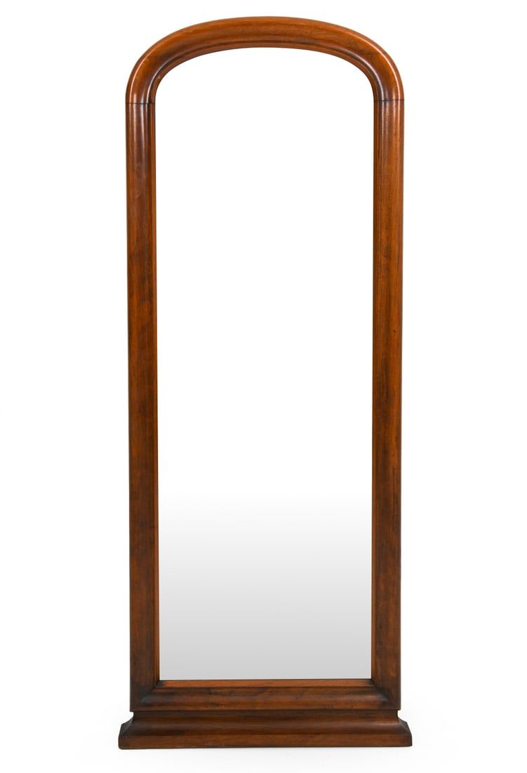 REGENCY STYLE MAHOGANY WALL MIRROR: Carved mahogany wall mirror with curved arch shape to top. Dimensions: H 51" x W 18.75". Condition: Scuffs and few small dings to wood. Wear consistent with age and use. A111