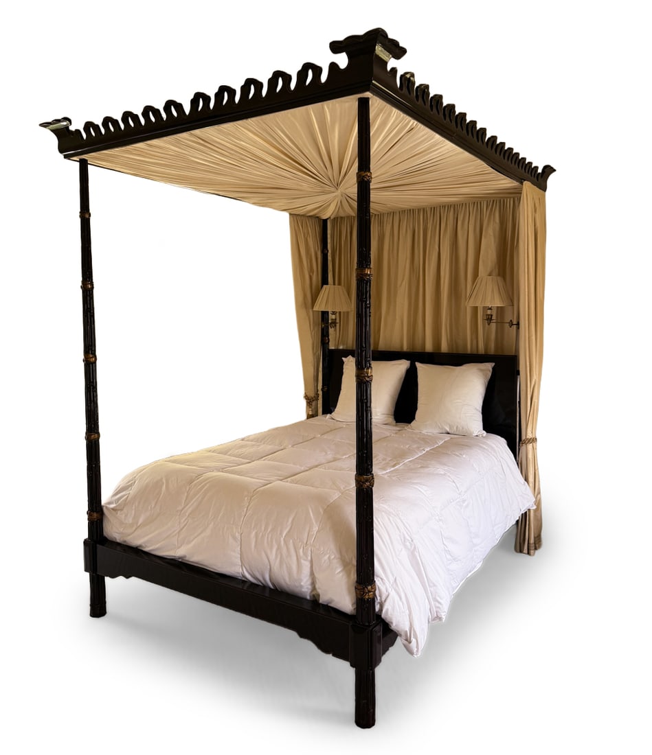 MICHAEL SMITH BAKER EBONY & GILT CANOPY BED FRAME: For Baker Furniture Company. Regency style 4-poster canopy bed with parcel-gilt and ebonized finish. Carved decoration in reed and ribbon design. With two lamps to either side of headboard posts. Fits