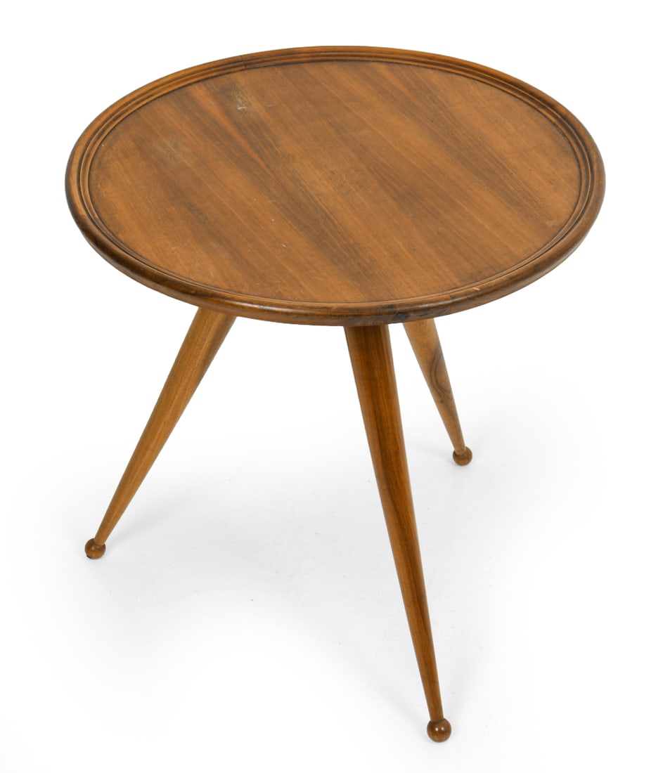 BORSANI STYLE ITALIAN WALNUT TRIPOD SIDE TABLE: Walnut side table. Round top with slightly raised carved edge. Tripod base with tapered legs and ball feet. Italy, circa 1960s. Dimensions: H 20" x Dia. 19.5". Condition: Rubs and water spots to top. 