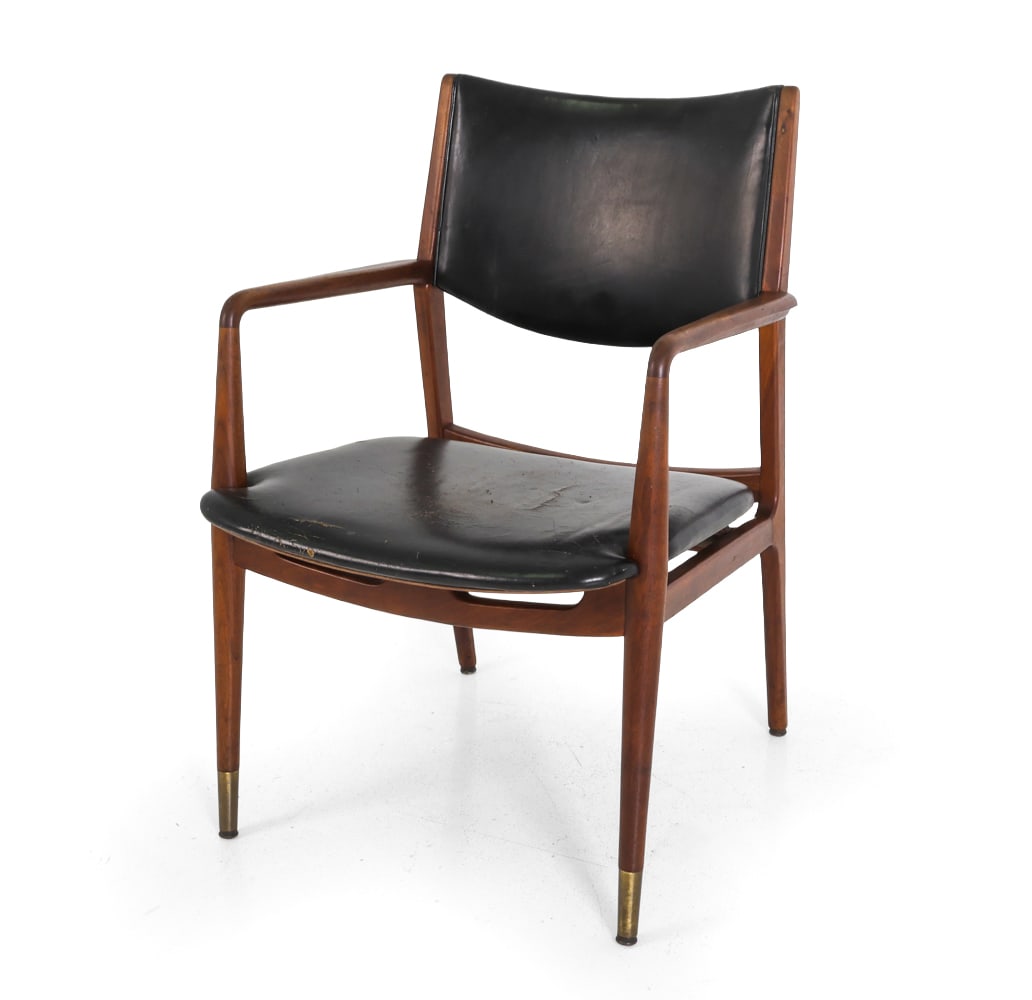 GEORGE REINOEHL FOR STOW & DAVIS WALNUT ARMCHAIR: Armchair designed by George Reinoehl for Stow & Davis. Walnut frame and leather upholstery. Front legs capped by brass sabots. Marked underneath. circa 1960s. Dimensions: H 34" x W 22.5" x D 23" x SH 