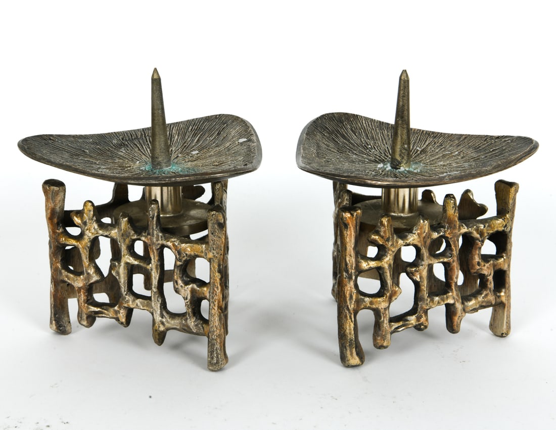 PAIR BRUTALIST BELGIUM BRASS CANDLE HOLDERS: Pair of cast brass candleholders. Architectural base with central prickets. Belgium, circa 1970s. Dimensions: H 5.5" x W 5" x D 4.75" Condition: Surface with minor oxidation and patina. Candle wax rem