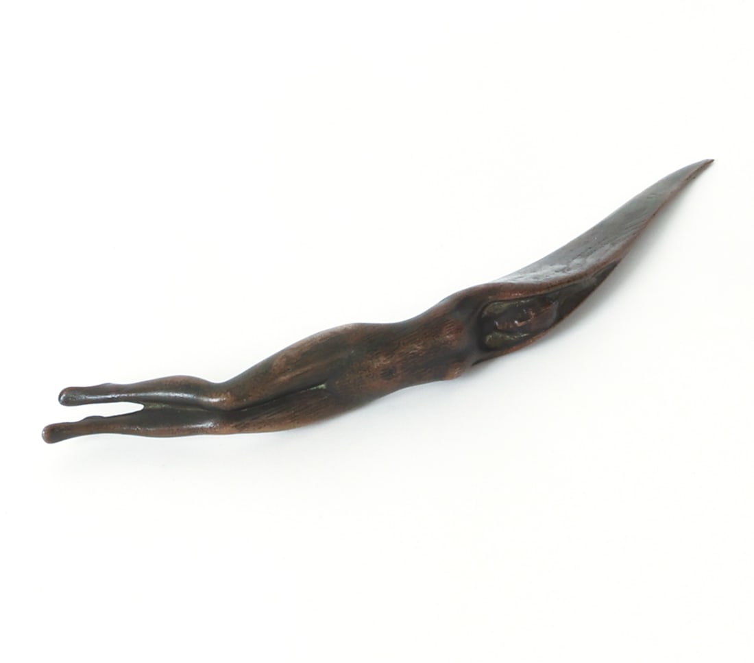 BRONZE FEMALE NUDE LETTER OPENER: Marked 'H.W.' to blade. Early 20th century. Dimensions: H 11" x W 1.25" x D 2.75". Condition: Light surface marks and rubs. Wear consistent with age and use.