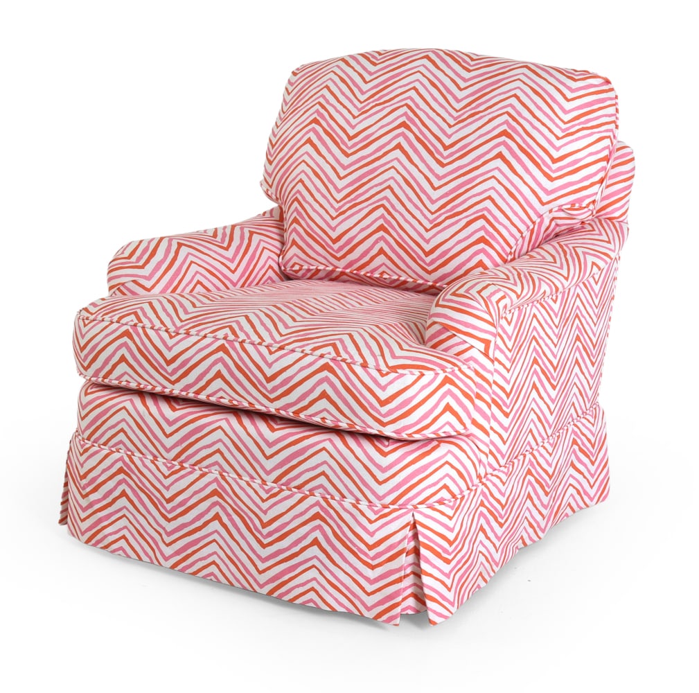 GEORGE SMITH STYLE LOUNGE CHAIR: Roll-arm club chair with skirt in red tone patterned upholstery. Tapered wooden legs beneath. 20th century. Dimensions: H 34" x W 31" x D 32" x SH 17.25". Condition: Few faintly discolored spots. Wear