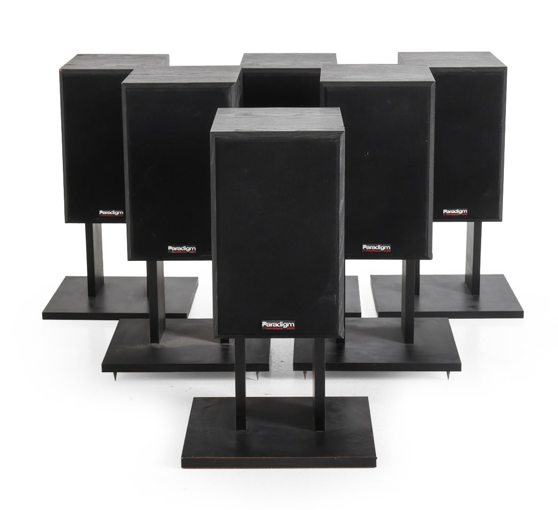 (6) PARADIGM TITAN SPEAKERS W/ PEDESTALS: (6) Paradigm Performance Series speakers with pedestals. Dimensions: H 12.5" x W 7.75" x D 9.5" Condition: Wear consistent with age and use. Untested. Couple of light scuffs.