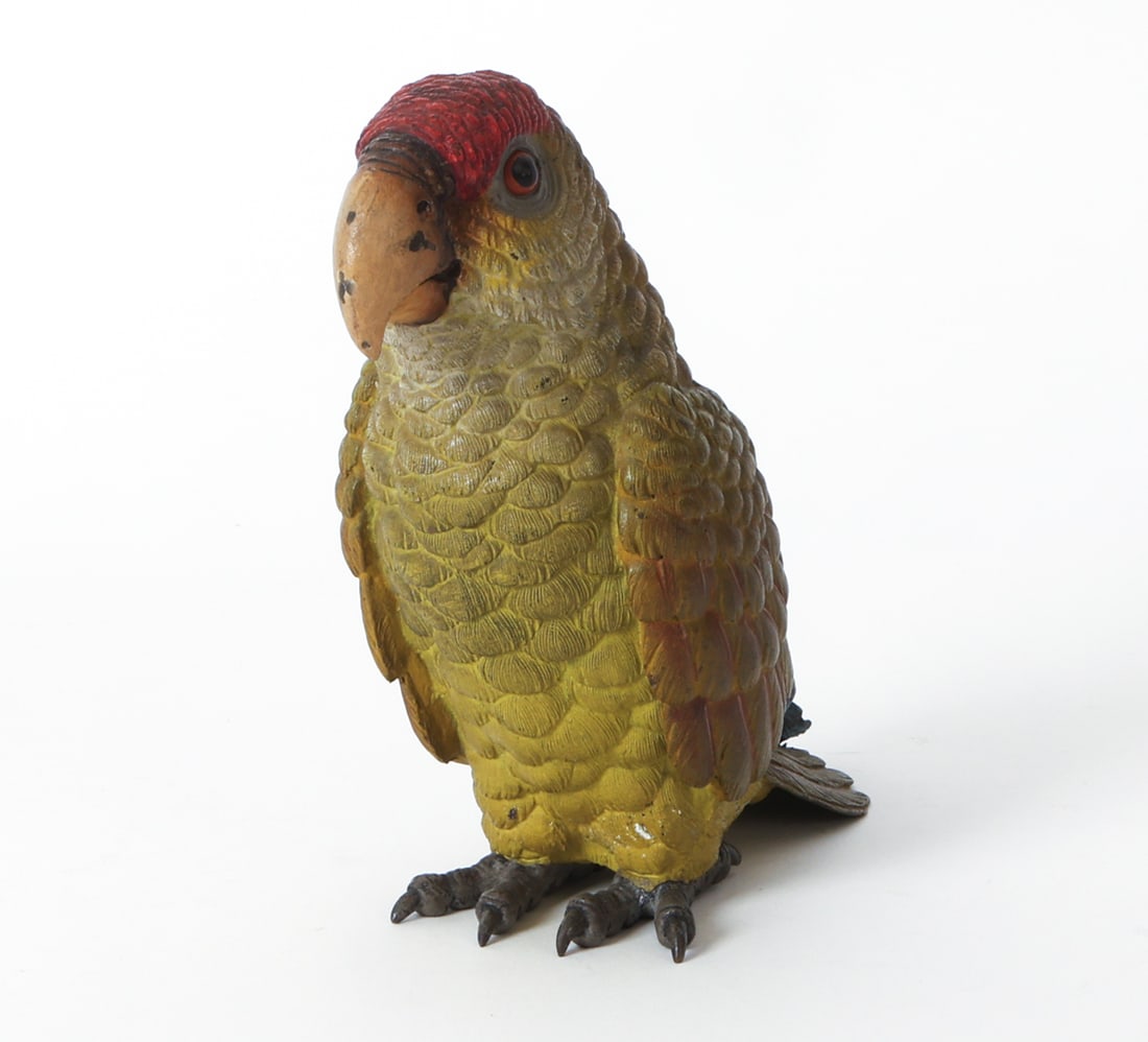 ANTIQUE COLD PAINTED VIENNA BRONZE PARROT: Bronze parrot figure in colorful painted finish. Dimensions: H 7" x W 3.5" x D 6.5". Condition: Light scuffs and rubs. Wear consistent with age and use as displayed.
