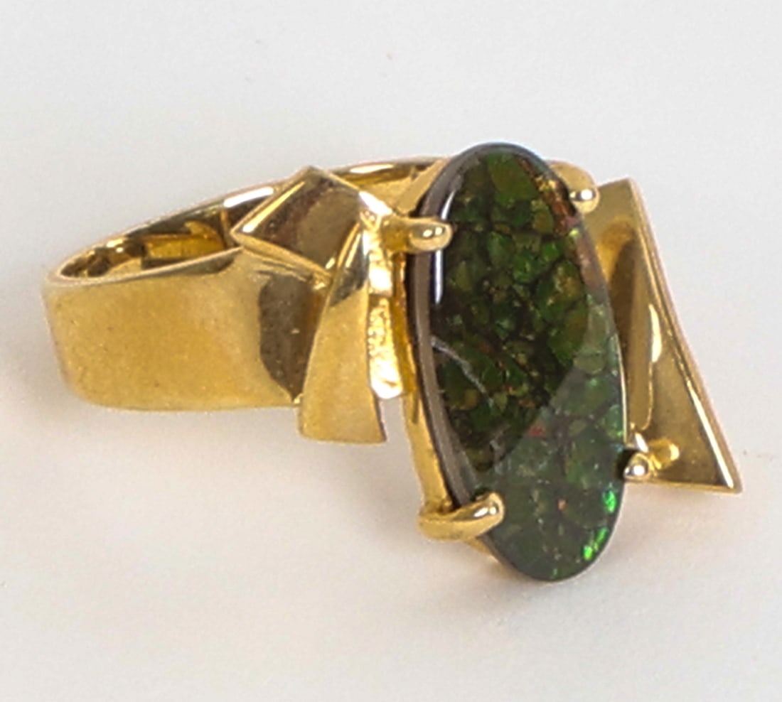 14K GOLD & AMMOLITE RING: Gold ring with ammolite stone to setting. Marked 14k to band, with other indistinct mark. Dimensions: Ring Size 8. Condition: Light scuffs. Wear consistent with age and use.