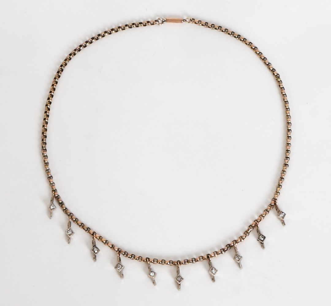 14K GOLD & DIAMOND NECKLACE: Gold necklace with string of diamonds in square shaped settings. Marked to clasp. Dimensions: L 15.5". Condition: Faint rubs, wear consistent with age and use.