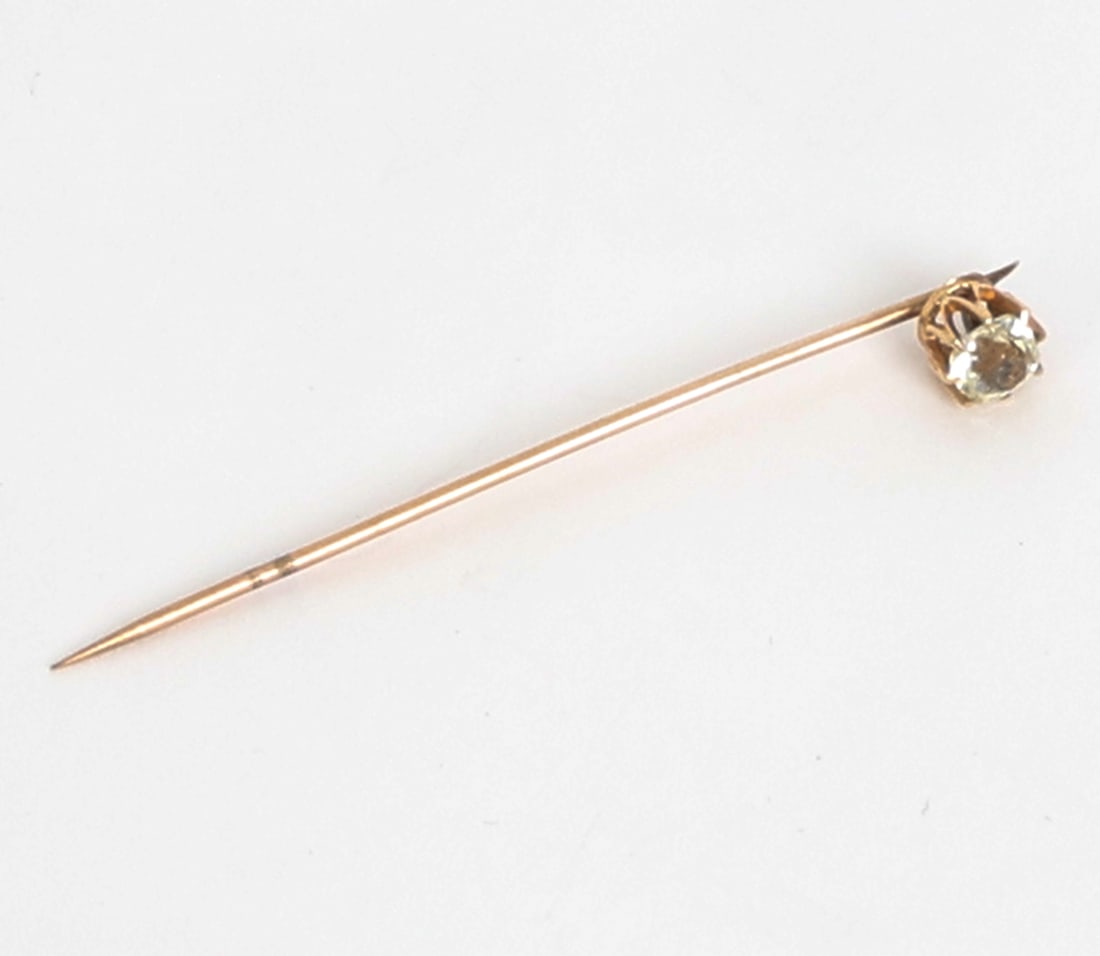 14K GOLD STICK PIN WITH RHINESTONE: Stick pin with Rhinestone to end. Unmarked. Dimensions: L 2.25". Condition: Rubs to pin. Wear consistent with age and use.