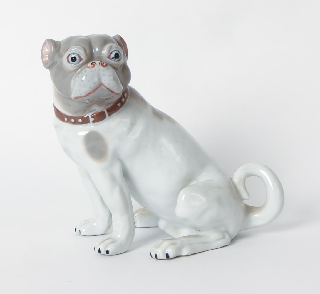SEYMORE MANN MUSEO PORCELAIN PUG DOG FIGURE: Marked underneath, First Edition. Porcelain ceramic figure of a pug dog. Circa 1970s. Dimensions: H 7.5" x W 4.75" x D 7.5". Condition: Faint scuffs and light surface soiling. Wear consistent with age